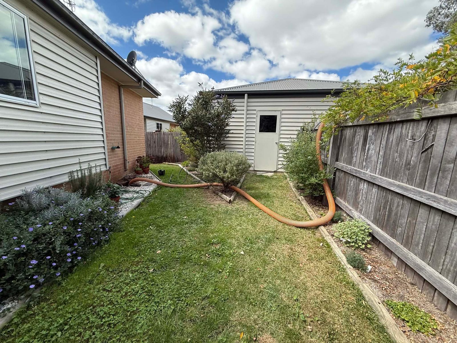 GreenVac compact rig in tight residential laneway demonstrating access advantage