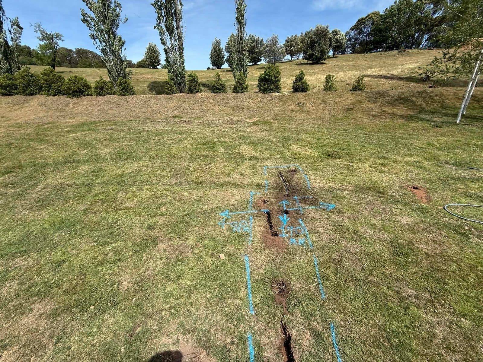 Utility potholing exposing underground pipe depth, Canberra